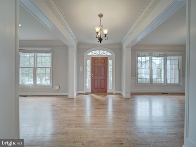 8429 Link Hills Loop, Gainesville, VA 20155 - foyer entrance with a chandelier, light wood finished floors, and ornamental molding