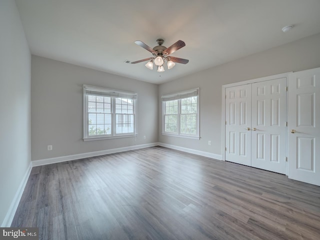 8429 Link Hills Loop, Gainesville, VA 20155 - unfurnished bedroom with dark wood finished floors, a closet, and a ceiling fan