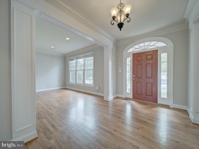 8429 Link Hills Loop, Gainesville, VA 20155 - foyer featuring plenty of natural light, a chandelier, light wood-style floors, and crown molding