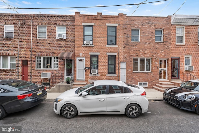 206 Fernon St, Philadelphia, PA 19148 - view of property featuring brick siding and cooling unit