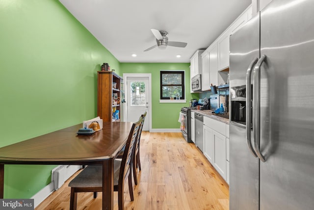 206 Fernon St, Philadelphia, PA 19148 - kitchen featuring appliances with stainless steel finishes, white cabinets, ceiling fan, light wood-style flooring, and recessed lighting