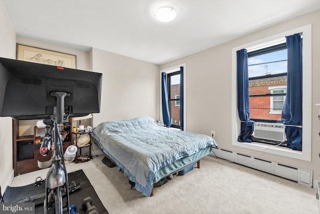 206 Fernon St, Philadelphia, PA 19148 - carpeted bedroom featuring a baseboard heating unit, multiple windows, and cooling unit