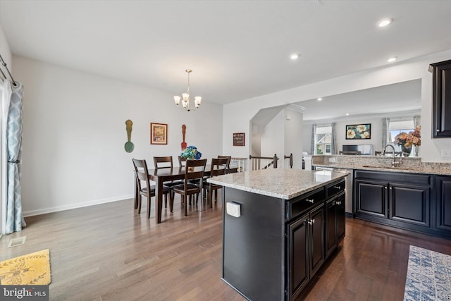 515 Quarry Point Rd, Malvern, PA 19355 - kitchen featuring wood finished floors, a center island, a chandelier, recessed lighting, and light stone countertops