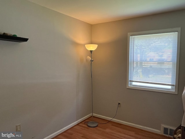 6313 Bardu Ave, Springfield, VA 22152 - empty room with wood finished floors and baseboards