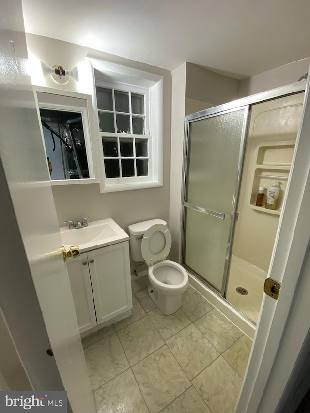 6313 Bardu Ave, Springfield, VA 22152 - full bath with vanity, a stall shower, and marble finish flooring