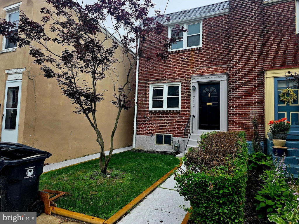 1712 Tulip St, Wilmington, DE 19805 - view of home's exterior featuring brick siding and entry steps