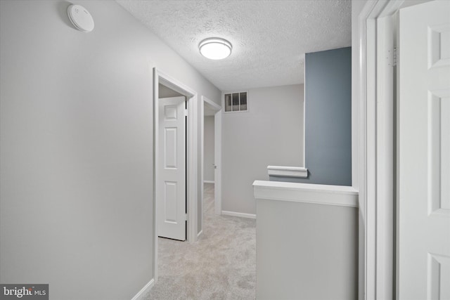 6112 Hillview Ct, Manassas, VA 20112 - corridor featuring light carpet and a textured ceiling