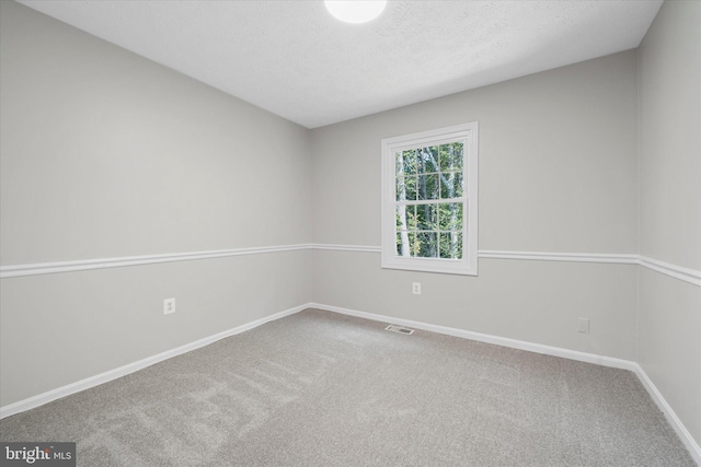6112 Hillview Ct, Manassas, VA 20112 - spare room featuring carpet floors and a textured ceiling