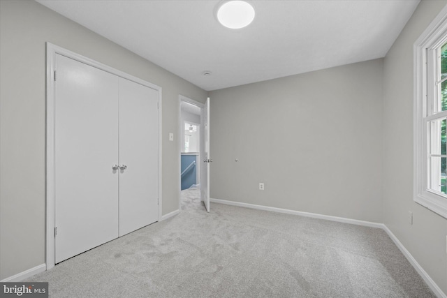 6112 Hillview Ct, Manassas, VA 20112 - unfurnished bedroom with carpet floors, multiple windows, and a closet