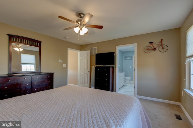 2018 Silver Bell Ct, Culpeper, VA 22701 - bedroom featuring multiple windows, light colored carpet, and ensuite bath
