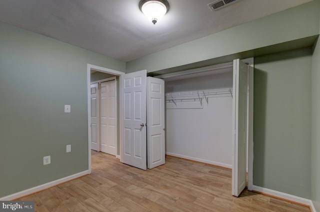 2018 Silver Bell Ct, Culpeper, VA 22701 - unfurnished bedroom featuring light wood-type flooring and a closet