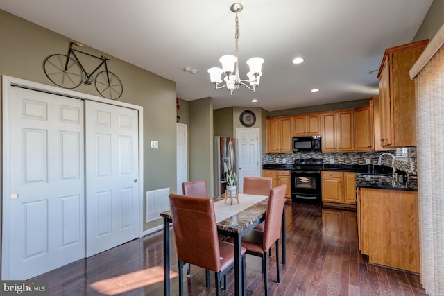2018 Silver Bell Ct, Culpeper, VA 22701 - dining area featuring a chandelier, dark wood-type flooring, and recessed lighting
