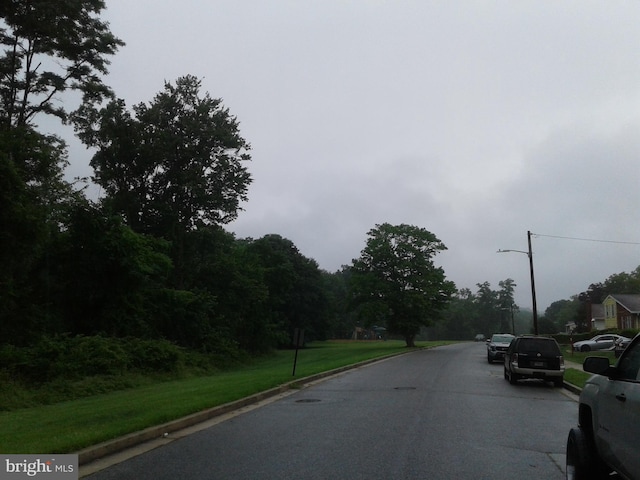 1209 Idylwood Rd, Pikesville, MD 21208 - view of asphalt road featuring street lighting and curbs