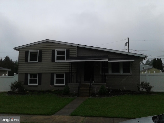 1209 Idylwood Rd, Pikesville, MD 21208 - tri-level home with covered porch and brick siding