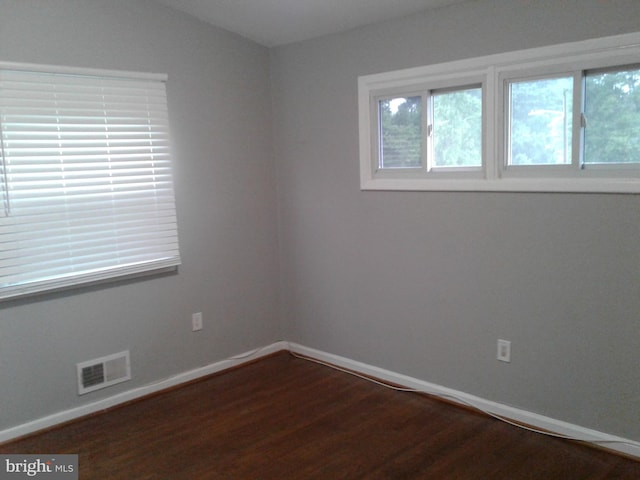 1209 Idylwood Rd, Pikesville, MD 21208 - unfurnished room with dark wood-style flooring and baseboards