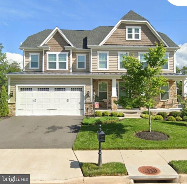 25983 Lilac Oaks Pl, Aldie, VA 20105 - craftsman inspired home featuring driveway, an attached garage, a porch, stone siding, and a front lawn