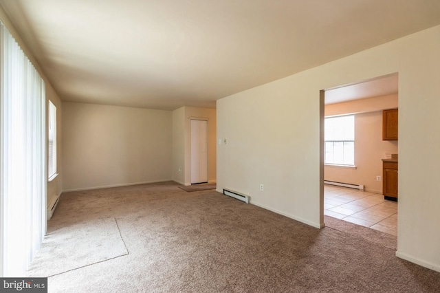 46 Hampshire Rd, Sicklerville, NJ 08081 - unfurnished room featuring a baseboard heating unit, light carpet, a baseboard radiator, and light tile patterned floors