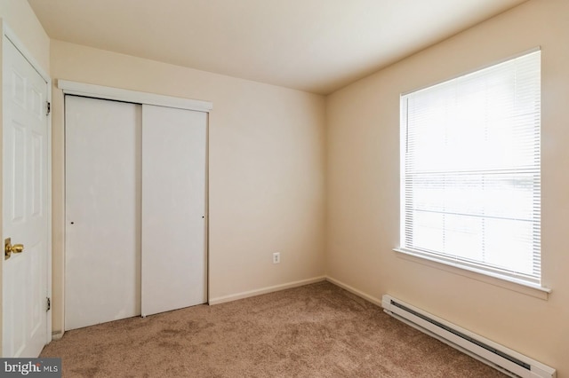 46 Hampshire Rd, Sicklerville, NJ 08081 - unfurnished bedroom with a baseboard radiator, carpet floors, and a closet