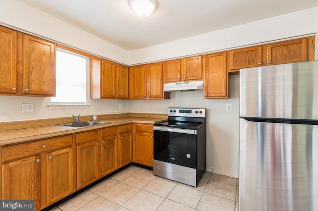 46 Hampshire Rd, Sicklerville, NJ 08081 - kitchen with appliances with stainless steel finishes, under cabinet range hood, brown cabinets, and light countertops