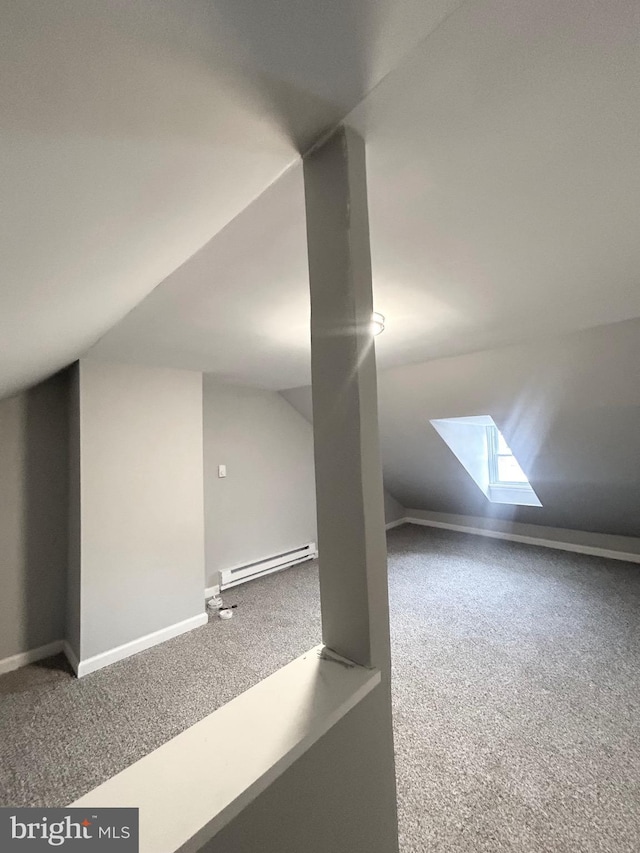 533 Franklin St, West Reading, PA 19611 - bonus room with a baseboard radiator, carpet flooring, vaulted ceiling, and a skylight