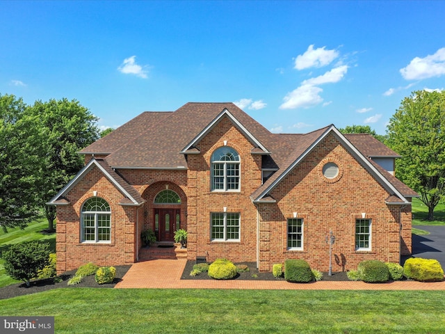 22124 Whitestone Ct, Smithsburg, MD 21783 - traditional-style home featuring brick siding, a front yard, and a shingled roof