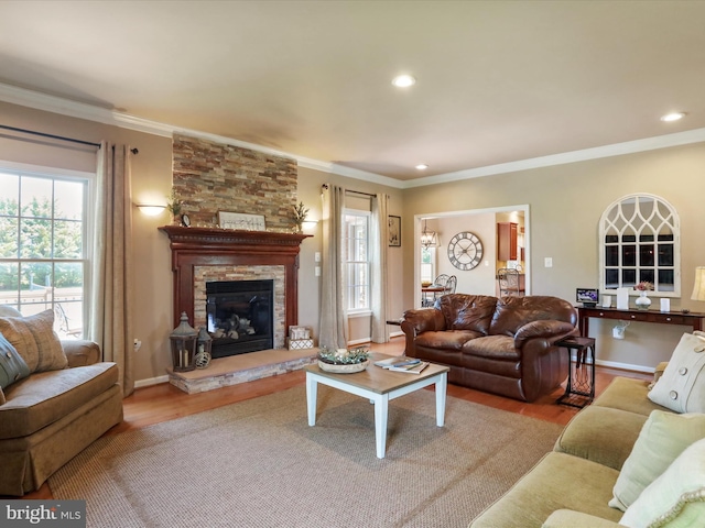 22124 Whitestone Ct, Smithsburg, MD 21783 - living room with wood finished floors, crown molding, healthy amount of natural light, a fireplace, and recessed lighting