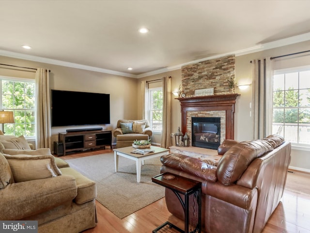 22124 Whitestone Ct, Smithsburg, MD 21783 - living room with plenty of natural light, light wood-style floors, a fireplace, ornamental molding, and recessed lighting