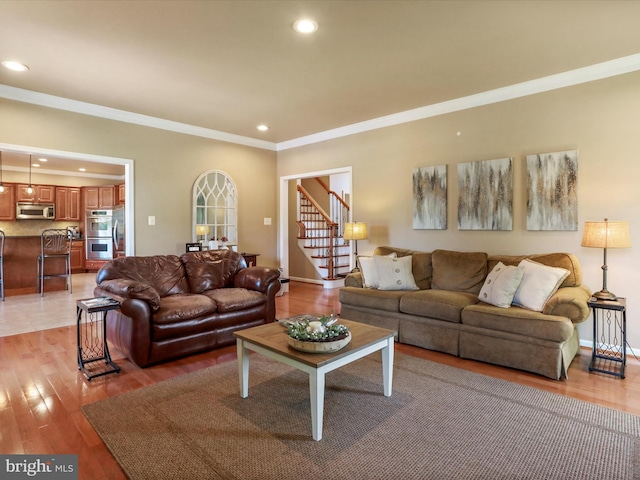 22124 Whitestone Ct, Smithsburg, MD 21783 - living room featuring crown molding, recessed lighting, light wood-style flooring, and stairs