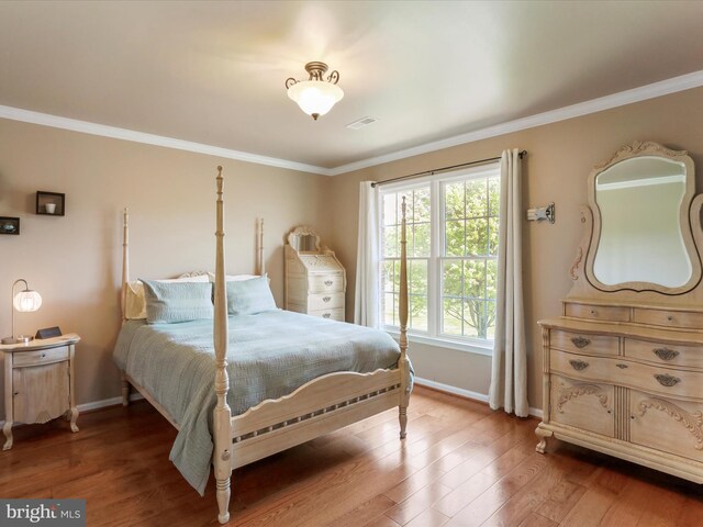 22124 Whitestone Ct, Smithsburg, MD 21783 - bedroom with crown molding and light wood-style floors
