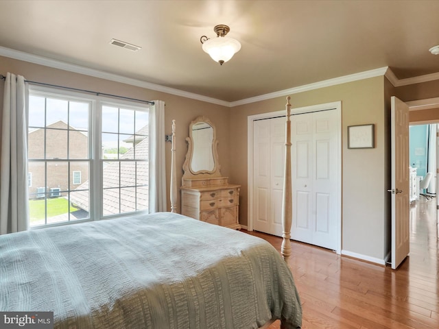 22124 Whitestone Ct, Smithsburg, MD 21783 - bedroom with multiple windows, wood finished floors, a closet, and crown molding