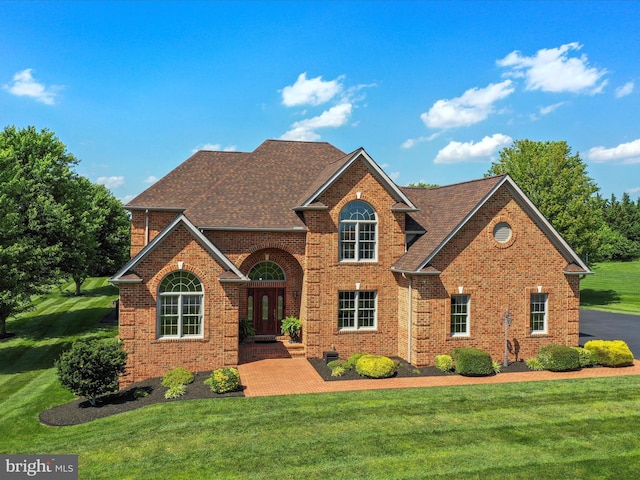 22124 Whitestone Ct, Smithsburg, MD 21783 - traditional home featuring brick siding, a front lawn, french doors, and a shingled roof