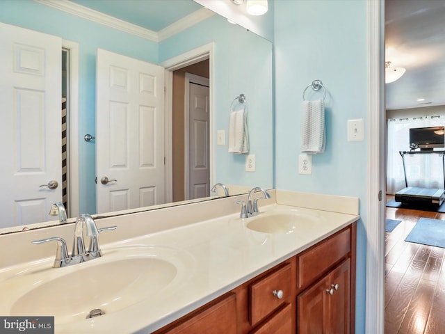 22124 Whitestone Ct, Smithsburg, MD 21783 - bathroom featuring double vanity, wood finished floors, connected bathroom, and ornamental molding