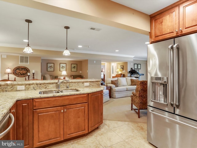 22124 Whitestone Ct, Smithsburg, MD 21783 - kitchen featuring stainless steel appliances, crown molding, open floor plan, brown cabinetry, and light stone counters