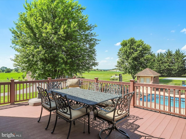 22124 Whitestone Ct, Smithsburg, MD 21783 - wooden terrace featuring an outbuilding, outdoor dining space, and an exterior structure