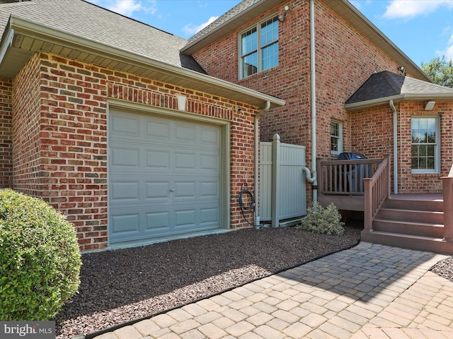 22124 Whitestone Ct, Smithsburg, MD 21783 - view of home's exterior with an attached garage, brick siding, and a deck