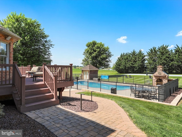 22124 Whitestone Ct, Smithsburg, MD 21783 - view of pool with a wooden deck, a patio area, an outbuilding, and a fireplace