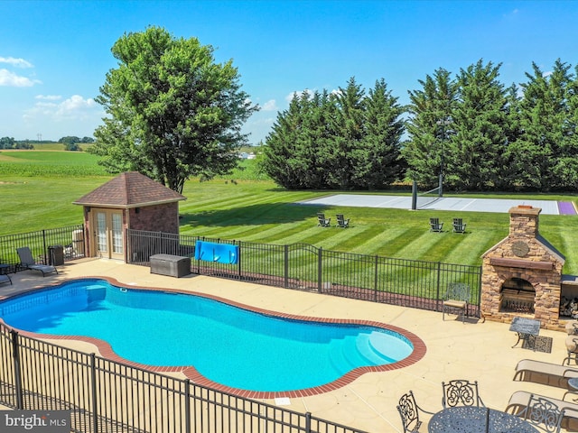 22124 Whitestone Ct, Smithsburg, MD 21783 - view of pool with a fireplace, a patio, an outbuilding, a storage structure, and french doors
