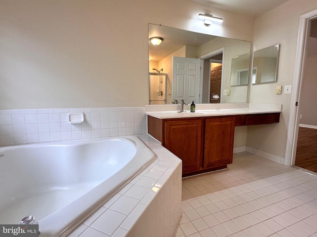8980 Harrover Pl Unit 80B, Lorton, VA 22079 - bathroom featuring vanity, a garden tub, tile patterned floors, and a shower stall