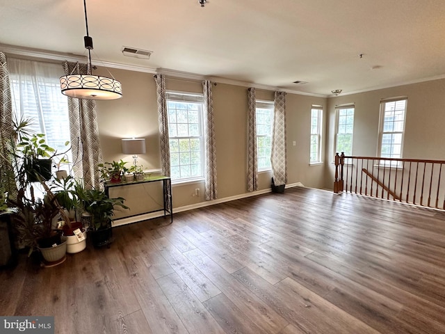 8980 Harrover Pl Unit 80B, Lorton, VA 22079 - empty room featuring healthy amount of natural light, wood-type flooring, ornamental molding, and a pendent fire sprinkler