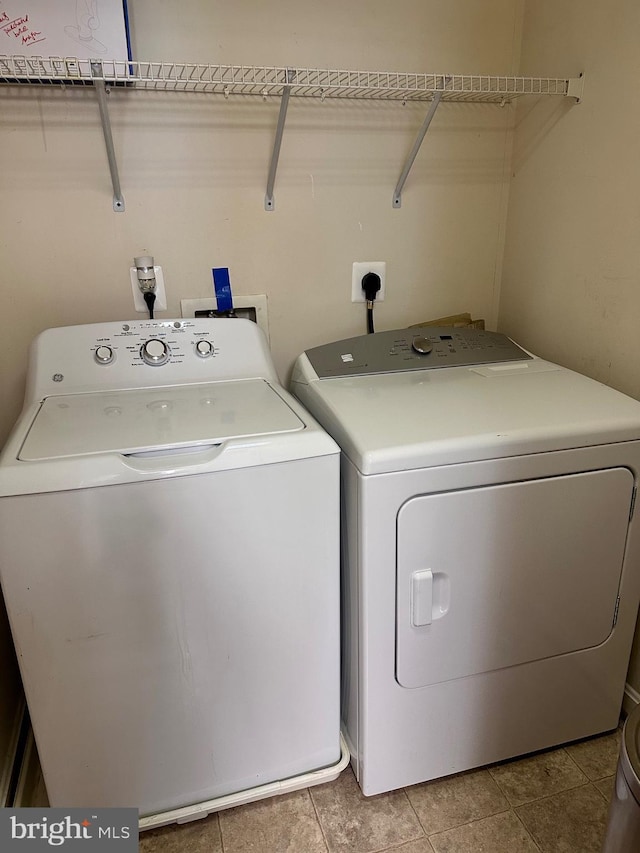 8980 Harrover Pl Unit 80B, Lorton, VA 22079 - laundry room featuring separate washer and dryer and light tile patterned floors