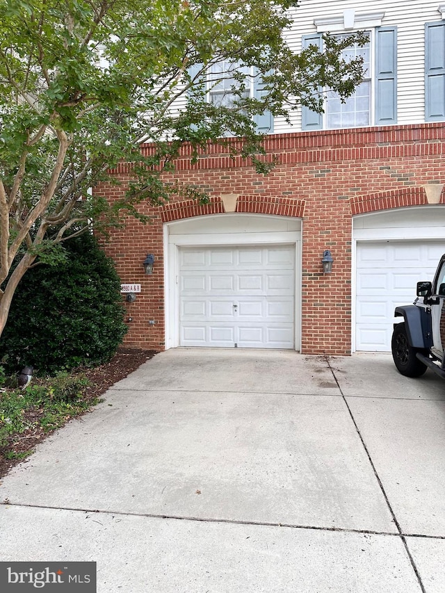 8980 Harrover Pl Unit 80B, Lorton, VA 22079 - garage featuring concrete driveway