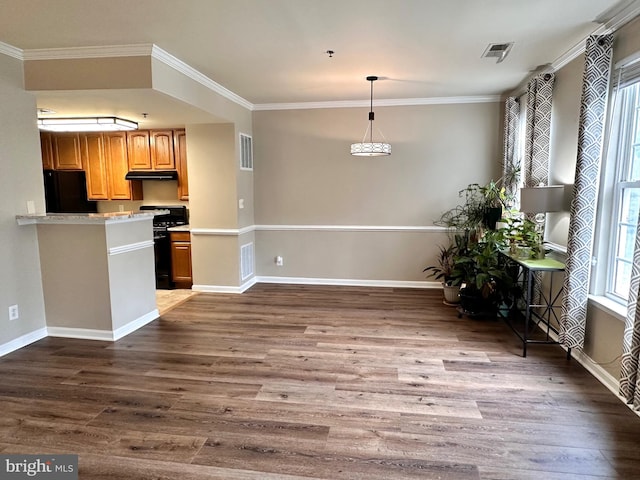 8980 Harrover Pl Unit 80B, Lorton, VA 22079 - kitchen featuring gas range, black fridge, light countertops, dark wood-type flooring, and crown molding