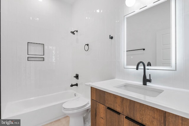 1338 N Franklin St, Philadelphia, PA 19122 - bathroom featuring vanity, shower / bath combination, and tile walls