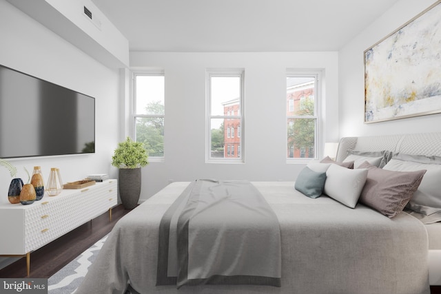 721 E 22nd St, Baltimore, MD 21218 - bedroom featuring wood finished floors and multiple windows