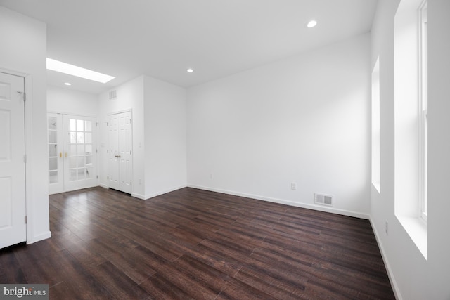 721 E 22nd St, Baltimore, MD 21218 - empty room featuring dark wood-style flooring, recessed lighting, and a skylight