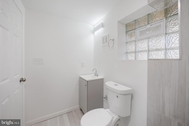 721 E 22nd St, Baltimore, MD 21218 - bathroom with vanity and wood finished floors