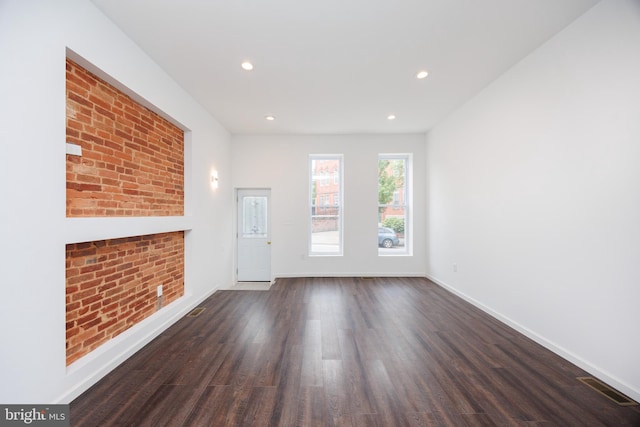 721 E 22nd St, Baltimore, MD 21218 - unfurnished living room featuring dark wood-style flooring and recessed lighting