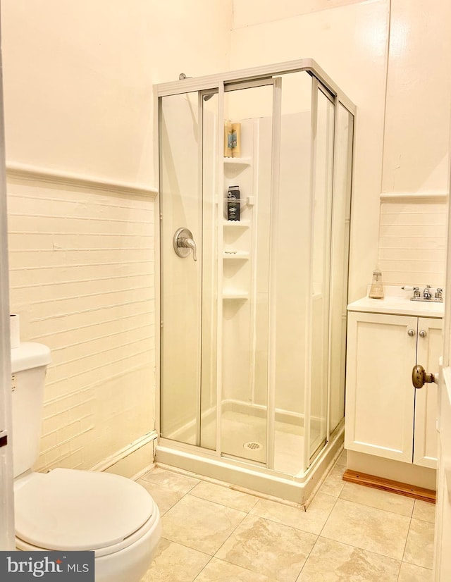 5904 Harford Rd, Baltimore, MD 21214 - bathroom featuring a shower stall, tile patterned flooring, and wainscoting