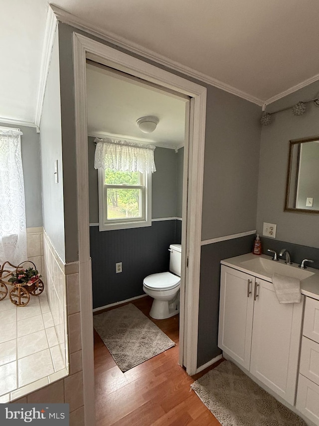352 Almond Rd, Pittsgrove, NJ 08318 - bathroom with ornamental molding, wood finished floors, vanity, and wainscoting