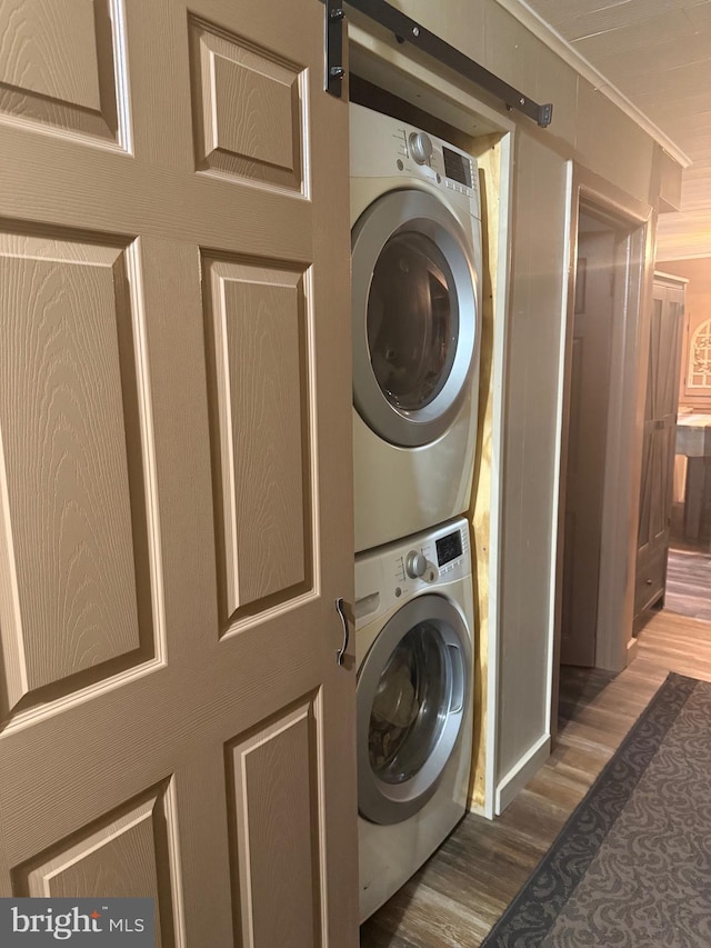 352 Almond Rd, Pittsgrove, NJ 08318 - laundry area featuring stacked washer / drying machine, wood finished floors, and crown molding